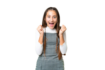 Young girl over isolated chroma key background celebrating a victory in winner position