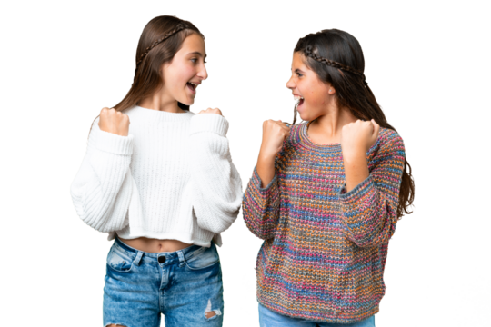 Friends girls over isolated chroma key background celebrating a victory