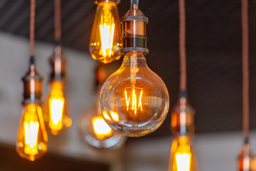 Decorative antique edison style filament light bulbs hanging from ceiling