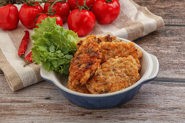 Fried salmonn cutlet in the bowl