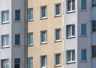 Windows and walls in a multi-storey building. Background