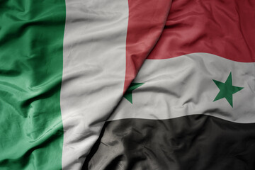 big waving national colorful flag of italy and national flag of syria .