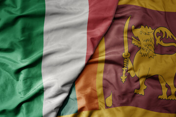 big waving national colorful flag of italy and national flag of sri lanka .