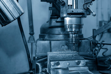 The drilling process on NC milling machine with brass material.