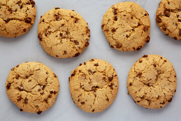 Homemade Cookies with Milk Chocolate Chunks on a gray background, top view. Flat lay, overhead, from above.