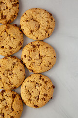 Homemade Cookies with Milk Chocolate Chunks on a gray background, top view. Flat lay, overhead, from above.