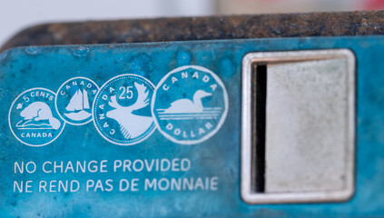 close up of coins picture on a pay phone