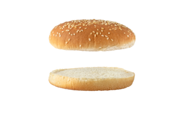 Sesame bun for burger top and bottom separated side view isolated transparent png. Round bread topped with sesame seeds cut in half.