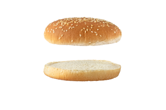 Sesame bun for burger top and bottom separated side view isolated transparent png. Round bread topped with sesame seeds cut in half.