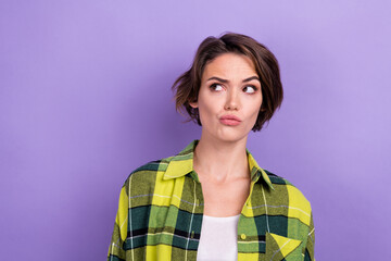 Photo of young ponder thoughtful woman student wear plaid shirt looking empty space guess pouted...