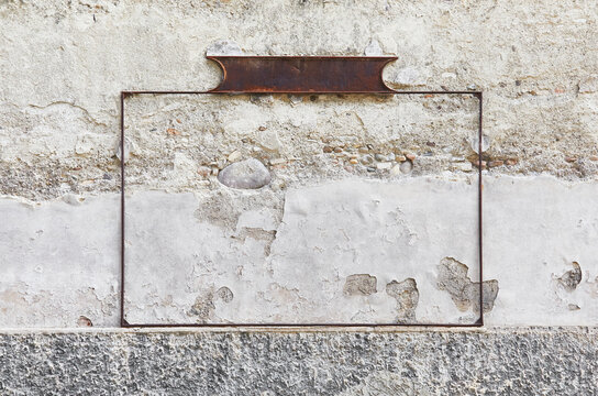 Crumbling house wall in Italy, with an old poster frame. Can also be used well for own image montages.