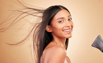 Hair, wind and hairdryer with woman in portrait, keratin treatment and beauty isolated on studio background. Shine, salon hairstyle and haircare with texture, growth and heat with electric appliance