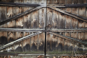 Entrance wooden door to the garage