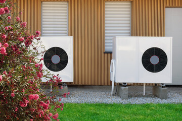 Eco-friendly air-source heat pumps on the front facade of a modern house