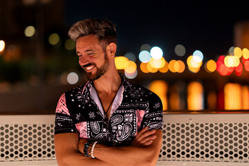 His radiant smile illuminates the night, as he stands in his shirt, a beacon of joy amidst the...