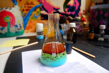 Chemical flask close-up. Conducting chemical experiments at home.
