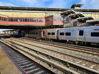 Woodside is a station on the Main Line of Long Island Rail Road and the Port Washington branch in Queens' Woodside in New York City. By train to the east from Penn Station Usa.  blur background people