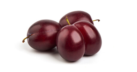 Isolated plums. One and a half of blue plum fruit with leaves isolated on white background.