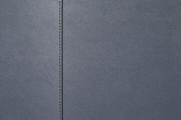close up black artificial leather texture with stitched or seam background.