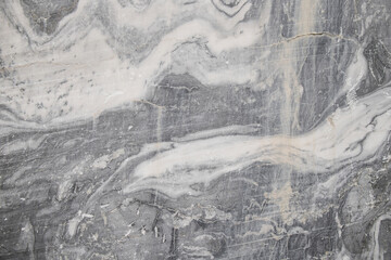 Natural marble background with black, white and grey lines. Closeup image.