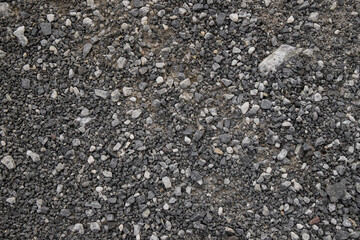 The texture of fine gray gravel made of small stones.