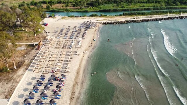Aerial view of the wild sandy beach near to river Acheron it flows into the Ionian Sea in the Epirus, Greece. Top view from drone.