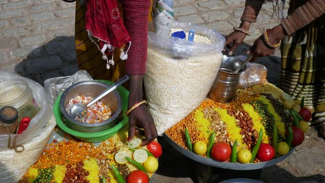 Traditional Indian street food snack Chana Jor Garam or Chana Chor Garam at a street market in Jaipur, Rajasthan, India. 