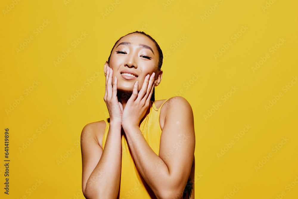 Wall mural surprised woman swimsuit happiness summer attractive fashion smile yellow joy beauty amazed portrait