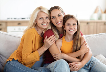 Joyful grandkid girl, adult daughter woman, happy excited grandma hugging