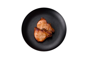 Delicious juicy pork or beef steak with salt, spices and herbs