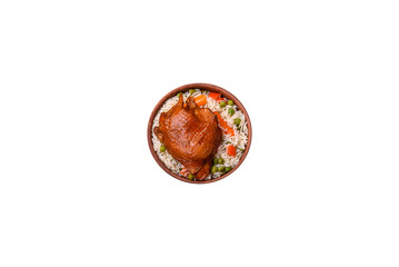Delicious boiled rice with chicken and vegetables or risotto with salt, spices and herbs