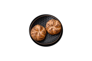 Delicious freshly baked crispy bun or kaiser roll with sesame seeds