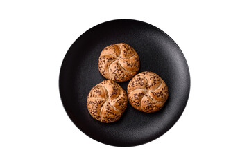 Delicious freshly baked crispy bun or kaiser roll with sesame seeds