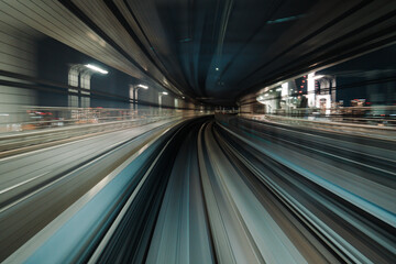 Fototapeta na wymiar Motion blurred of train moving inside tunnel with daylight in tokyo, Japan.