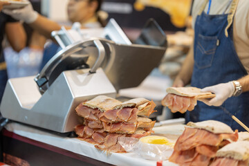 Cooking panini with prosciutto at the fair
