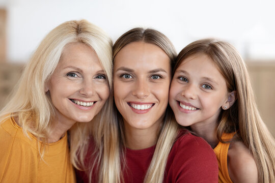 Positive caucasian family girl, woman and granny, closeup portrait