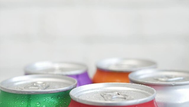 Various Cold, Sweet, and Carbonated Refreshing Drinks. Shooting with Refreshing Pop Can Drinks.