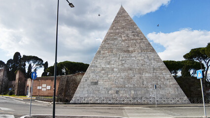 Ancient Pyramide Cestia and its architecture in white marble the famous sepulcher building at 12 A.C. houses the tomb of Caio Cestio Epulone it's located in Rome