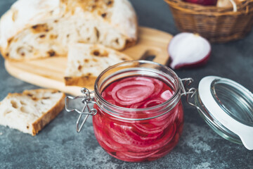 Pickled red onions with slices of homemade bread. Healthy organic food. top view. High quality photo