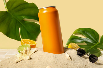 Can of soda with seashells, sunglasses and citrus fruits on sand, closeup