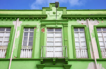 Street view of an old colonial building facade, Cuenca, Ecuador.