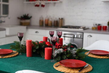 Interior light kitchen and red christmas decor. Preparing lunch at home on the kitchen concept