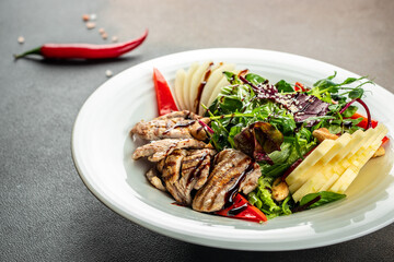 steak salad with vegetables and greens. Meat salad on a light background. Restaurant menu, dieting, cookbook recipe top view