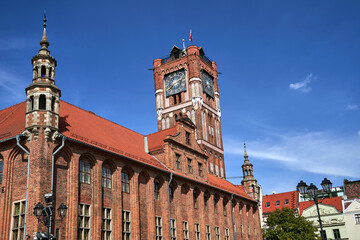 Fototapeta premium historic medieval town hall with clock tower in Torun