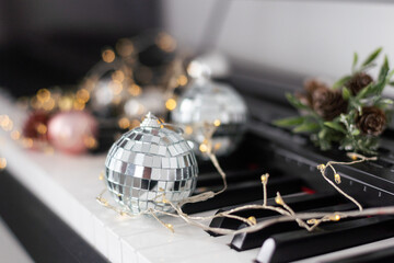 Piano keyboard with Christmas decoration, closeup.