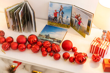 a Photobook of family. Photobook is gift. photo album next to gifts.
