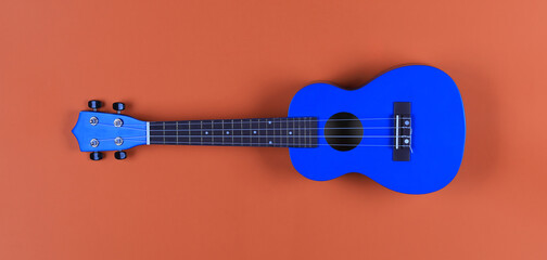 blue small ukulele isolated