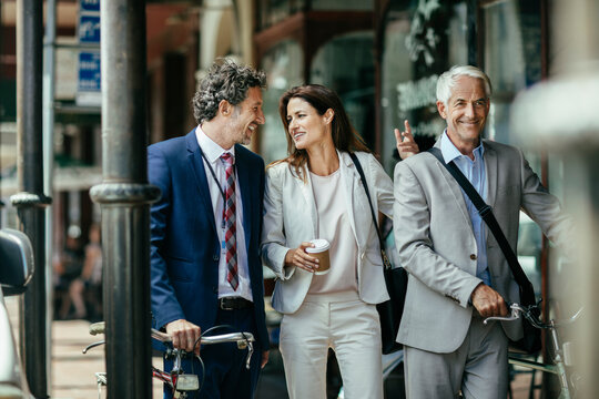 Diverse Group Of Business People And Coworkers Commuting To Work Together In The City