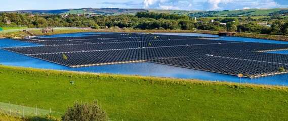 Aerial image of floating solar energy panels in Godley, United Kingdom. 