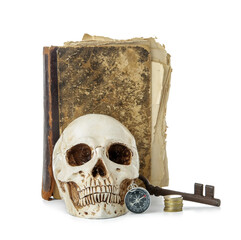 Human skull with old manuscripts, compass, key and golden coins isolated on white background